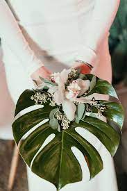 In myrtle beach we are blessed to have great weather for most of the year and that means lots of time and locations for outdoor weddings. Monstera Leaf Bridal Bouquet Tropical Wedding Bouquets Foliage Wedding Wedding Bouquets