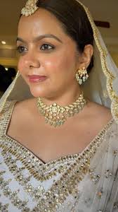 Transforming Richa into a radiant Indian bride, adorned in exquisite Kundan  Jewellery that intricately complements her glowing makeup and ethereal  white lehenga. Each brushstroke and jewel accentuates ...