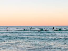Surfers riding waves at Bondi Beach