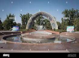 Fountain with Rudaki Monument to the Persian poet Rudaki of the same name,  life data 859-940 AD, Rudaki Park, Dushanbe, Tajikistan Stock Photo - Alamy