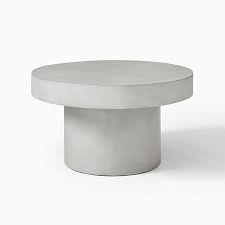 Round top is covered with clear glass. Volume Round Pedestal Coffee Table Concrete