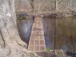 The Urban Legend of Hell's Bridge Northwest of Rockford this rickety old  metal footbridge crosses the Rogue River and has been dubbed as Hell's  Bridge. Urban legend has it that this is
