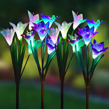 Color changing solar garden stakes with 6 lily flowers,1 butterfly & 1 dragonfly. Amazon Com Wohome Outdoor Solar Garden Stake Lights 4 Pack Solar Powered Lights With 16 Lily Flower Multi Color Changing Led Solar Landscape Lighting Light For Garden Patio Garden Outdoor