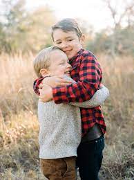 Brothers Hugging College Station Natural Family Photography Ryan Price Lifestyle Photography Family Outdoor Family Photos Natural Family Photography