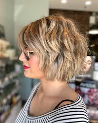 The fringe is kept longer and reaches the chin length while the subtle highlights in golden color blend wonderfully with the natural darker hair color. Chin Length Hairstyles For Thick Curly Hair Novocom Top