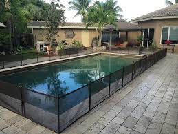 What is the cheapest option available within fencing? 2 Ft H X 12 Ft W Pet Fence Diy Section In Black With 5 Poles Featuring A Steel Pin At The Base For A 1 2 In Hole Pool Fence Diy