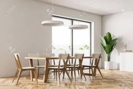 Use them in commercial designs under lifetime, perpetual & worldwide rights. Corner Of Modern Dining Room With White Walls Wooden Floor White Countertops And Table With Chairs 3d Rendering Copy Space Stock Photo Picture And Royalty Free Image Image 108019859