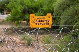 An electric fence is a barrier that uses electric shocks to deter animals and people from crossing a boundary. Electric Fence Pictures Download Free Images On Unsplash