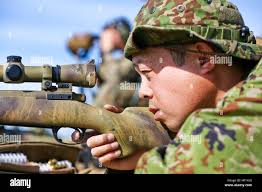 U.S. Air Force Col. Lance Wilkins, 53rd Weapons Evaluation Group commander  (left), collects the ceremonial guidon from Lt. Col. Adam Bright, outgoing  81st Range Control Squadron commander (right), during a change of command  ceremony at Tyndall Air ...