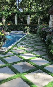 Secluded Private Retreat And Poolside Paving Using Conservation Grass Joints Between Step Stones Designed By Mondo Grass Pool Landscaping Small Pool Design