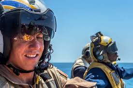 U.S. Navy Lt. Cmdr. Patrick Veith, left, participates