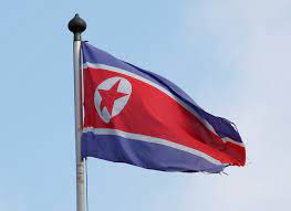 The north korean flag is a wide red horizontal band bordered by two thin white horizontal bands, which are bordered by two blue stripes. Navigating Options On North Korea