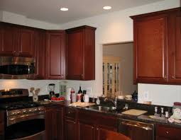 Dark hardwood floors also work to anchor the room. Cabinet Colors With Black Countertops Kitchen Colors With Dark Cabinets Kitchen Renovations Grey Painted Kitchen Kitchen Colors Cherry Cabinets Kitchen