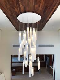 Depending on what sort of light fixtures, also called light fittings, you are planning to install steps might be a little bit different. Modern Foyer Chandelier Large Stairway Lighting Art Glass Contemporary Light Modern Ceiling Light Fixture For High Ceiling Spaces High Ceiling Lighting Modern Ceiling Light Modern Chandelier Foyer