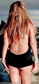 But our nick sources say the tattoo shows jesus on the cross with angel wings coming off the end the cross. Nick Cannon Appears On Tv Without Wedding Ring After Mariah Carey Split Daily Mail Online