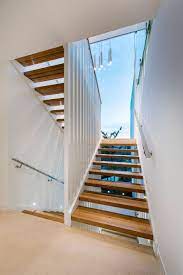 To stay within building regulations, a domestic staircase needs a rise of between 190mm and 220mm. Glass Roof Above The Staircase Allows In Natural Light Decoist Luxury Beach House Luxury Homes Architect House