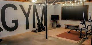 These include framing the walls, wiring the electricity, installing the heating. Creating A Home Gym In An Unfinished Basement On A 100 Budget Lovely Etc