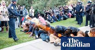 Uc Davis Police Placed On Leave After Pepper Spray Video Outrage Occupy Movement The Guardian