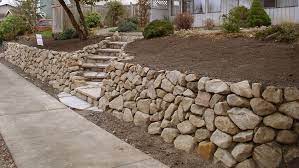 Installing a retaining wall can turn a disadvantaged area into a beautiful asset and can be incorporated into a garden, pond, or water feature. Retaining Walls Gallery Calendula Farm Earthworks