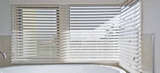 Indoor shutters offer what other window coverings cannot: 7 Waterproof Shower Blinds To Make Your Small Bathrooms Feel Larger