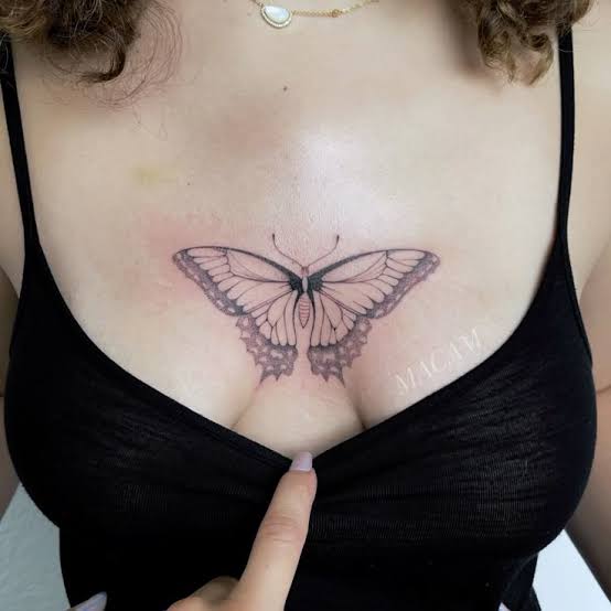 Delicate Butterfly Chest Tattoo – Fine Line Art