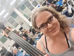 What is the meaning of playing bass clef when down four ringers?