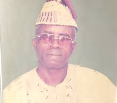 Ace footballer, Dimeji Lawal holds Fidau for dad.