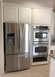 painting dark kitchen cabinets white