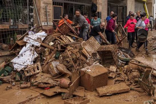 Mud-caked volunteers clean flood debris in a Spanish town as authorities  struggle to respond - St. Albert News