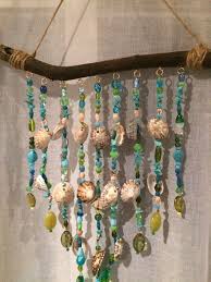 Pin By Freiraum Grafikdesign Malere On Windchimes Suncatchers Seashell Crafts Wind Chimes Homemade Seashell Wind Chimes