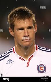 Chicago Fire forward Forward Brian McBride plays with his daughter Ella in  the back yard of their home Wednesday, Sept. 24, 2008 in Arlington Heights,  Ill. McBride returned to the U.S. to