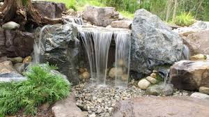 The water naturally tumbles over the rocks and has natural plantings on both sides. Build A Simple Backyard Waterfall Youtube