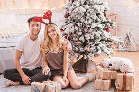 Maybe you would like to learn more about one of these? We Love Winter Holidays Cute Positive Nice Couple Sitting Under Stock Photo Picture And Royalty Free Image Image 66944200