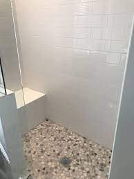 White Subway Tile With Pebble Stone Floors Pebble Shower Floor Stone Tile Bathroom Shower Tile