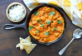 Add half of the ground spices, half of the ginger garlic paste, and half of the minced chilies to the chicken. Deliciosa Tikka Masala My Latina Table