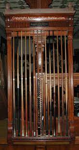 Tired of having your pool cues knocked over as they lean precariously against the table or a chair? Antique Brunswick Balke Collender Co Jewel Mahogany Cue Rack