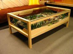 Once the layout is set, it's just a matter of purchasing the engines, cars and scenery that you like to. Lesthan Useful N Scale Train In Coffee Table