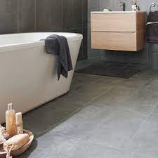 The best tile idea for monochrome bathrooms is to use bright white for walls and statement black tiles for flooring. Tiles Diy At B Q