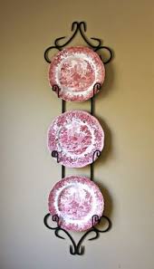 Wrought Iron Plate Rack Wall Farmhouse Wrought Iron Metal Plate Rack Wall Plate Rack Dish The single holder could accommodate a slightly larger plate if you don't mind the curly cue detail being covered at the top. wrought iron plate rack wall