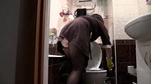 Anal on the toilet. A mature brunette cleans the toilet room and fucks her  sexy ass with a brush. Then, with a rubber dick, he fucks his hairy cunt. -  XNXX.COM