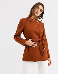 Crafted from luxurious pure wool and finished with a statement oversized collar, this elegant layer will belt up your everyday look in style. Ted Baker Drytach Short Wool Wrap Coat Tan Codipop