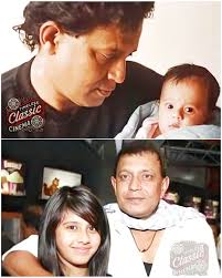 This image is a throwback family photograph of the Indian actor Mithun  Chakraborty with his wife, the former actress Yogita Bali, and their  children. The people in the photo are: Mithun Chakraborty: