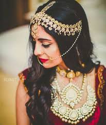 Loosely braided (almost open) hairstyle with pearl pins that comes over one shoulder. Trend Alert Brides Are Choosing To Keep Their Hair Open On Wedding Day Bye Bye Buns Shaadisaga