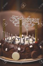 Swirl up a quick birthday breakfast shake before you are showered with gifts and this cake uses some intriguing healthy alternatives like tahini, dates, nut milk and bananas. A Close Up Of Chocolate Birthday Cake Holiday Treat Healthy Cake For A Child Decorated With Candles And Fireworks With The Word In Russian Congratulations In The Background Toning Stock Photo Picture