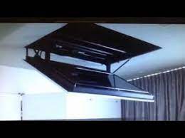 Mar 24, 2019 · another option is to instead consider a ceiling tv mount, these mounts hang your tv from the ceiling and are another way for saving space, you could also opt for a motorized flip down tv mount but we don't you have the same maneuverability as a good wall mount. Motorized Flip Down Flat Screen Tv Ceiling Mount Youtube Tv Ceiling Mount Swivel Tv Stand Wall Mounted Tv