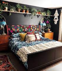 Boho Bedroom Style With Plant Patterns On Black Blankets Combined Colorful Pillows Carpet Patterns Home Decor Bedroom Bedroom Design Bohemian Bedroom Design