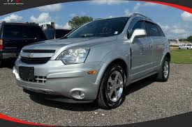 Image result for Silver Topaz 2013 Captiva