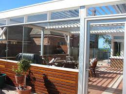 White Framed Glass Roof Enclosed Patio Ideas With Brown Chairs On Soft Natural Wood Floor On Enchanting Living Room And Lo Pergola Pergola Patio Enclosed Patio