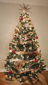 Some plain unpainted cut pallet pieces make the perfect rustic christmas tree decoration with nails hammered in to hang festive decorations from. A Rustic Christmas Tree Weekend Craft