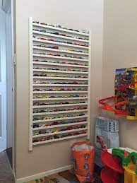 I built a wall mount for standard hot wheels tracks to mount to the wall. Diy Hot Wheels Matchbox 1 64 Diecast Car Display Using Side Rails From An Old Crib Super Easy Cribs Repurpose Repurposed Crib Old Cribs